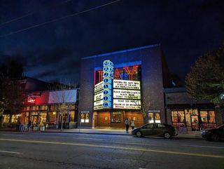 A photo of a movie theater at night