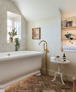 A bathtub in a neutral-toned bathroom