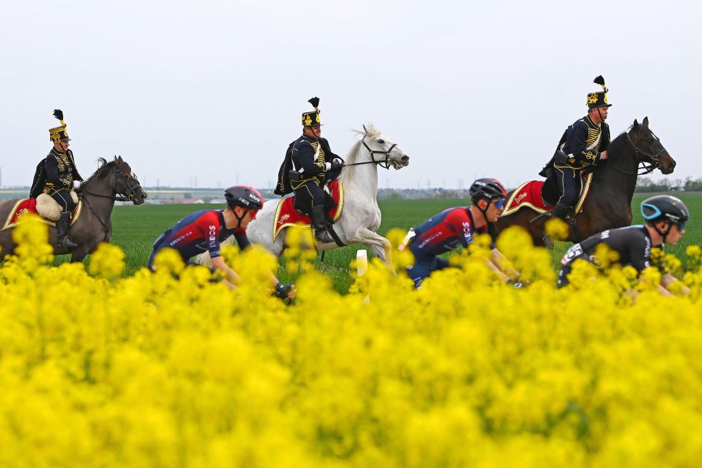 VISEGRAD HUNGARY MAY 06 Hungarian soldiers ride while the peloton competes during the 105th Giro dItalia 2022 Stage 1 a 195km stage from Budapest to Visegrd 337m Giro WorldTour on May 06 2022 in Visegrad Hungary Photo by Tim de WaeleGetty Images