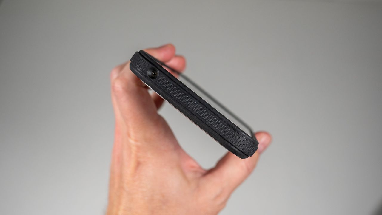 A Dbrand Ghost 2.0 case on a white Google Pixel 10 Pro XL