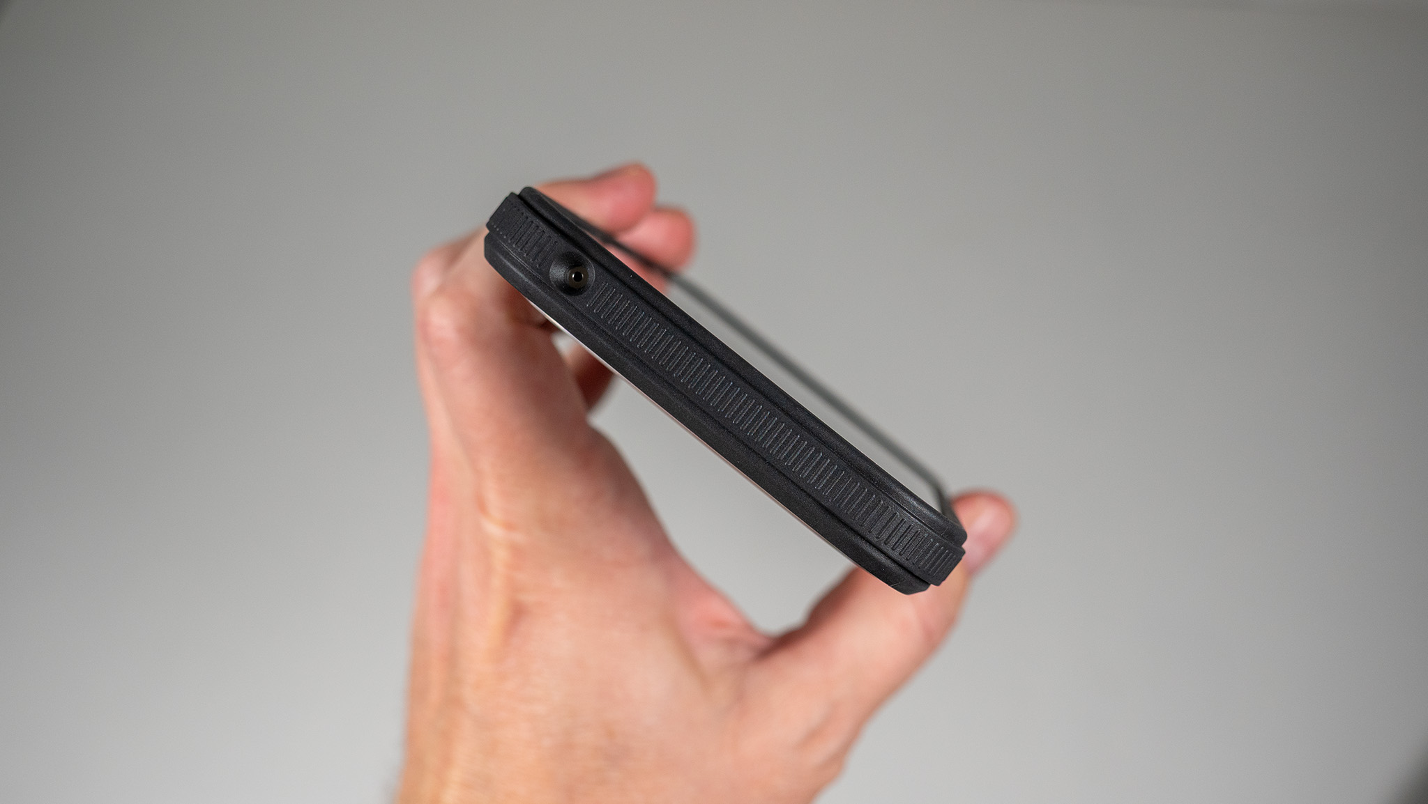 A Dbrand Ghost 2.0 case on a white Google Pixel 10 Pro XL