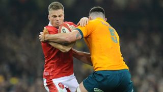 Gareth Anscombe is tackled by Cadeyrn Neville ahead of the Wales vs Australia live stream at RWC 2023