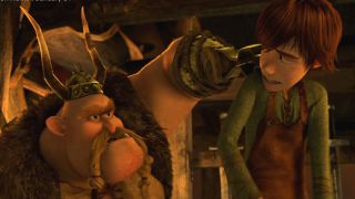 Gobber lifts Hiccup up as he reprimands him in How To Train Your Dragon.