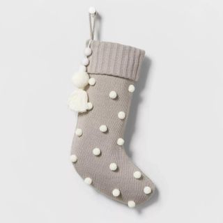 grey Christmas stocking with pom poms
