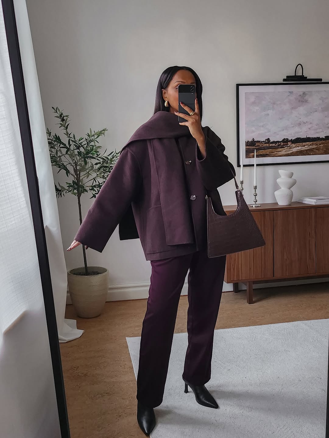 woman wearing brown maroon color trend fall 2025