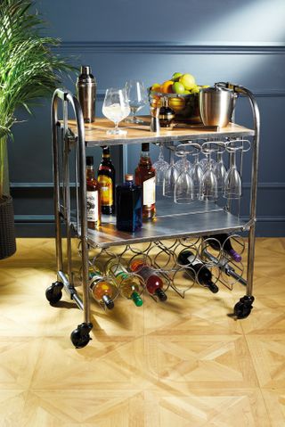 A bar cart with wine rack