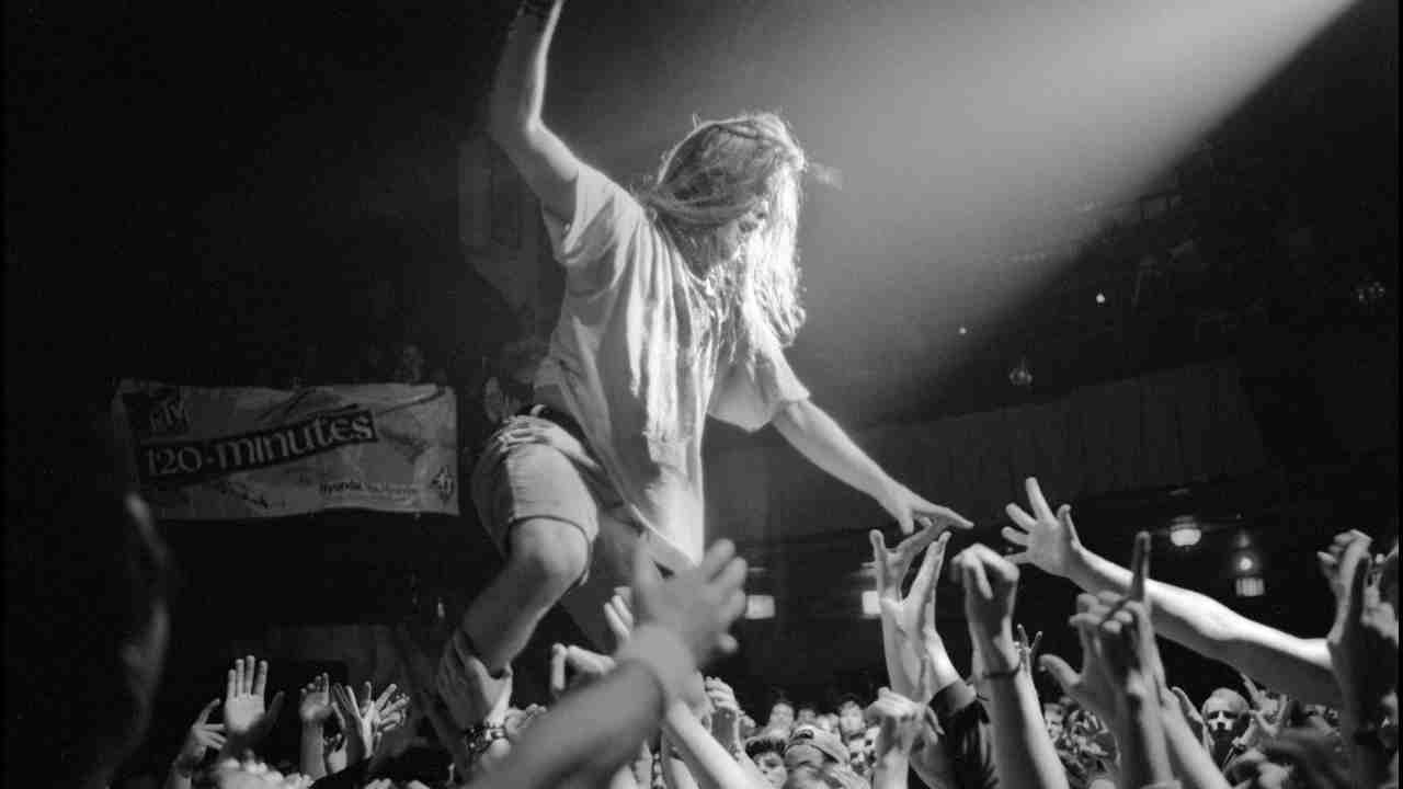 Blind Melon&amp;rsquo;s Shannon Hoon wralking over the crowd at a gig in the early 1990s