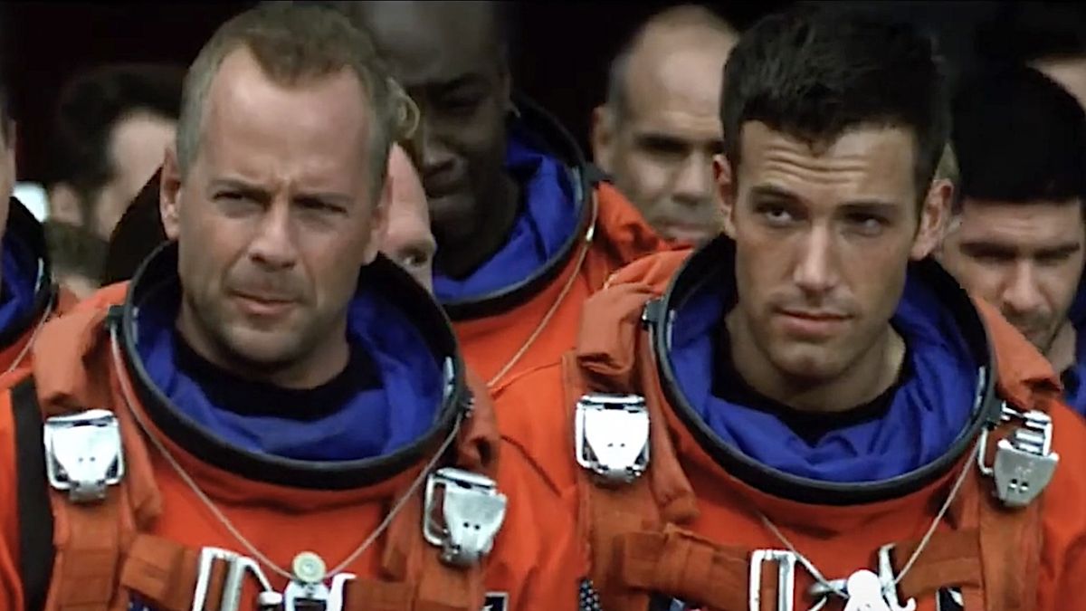 Bruce Willis and Ben Affleck wearing orange space suits in Armageddon