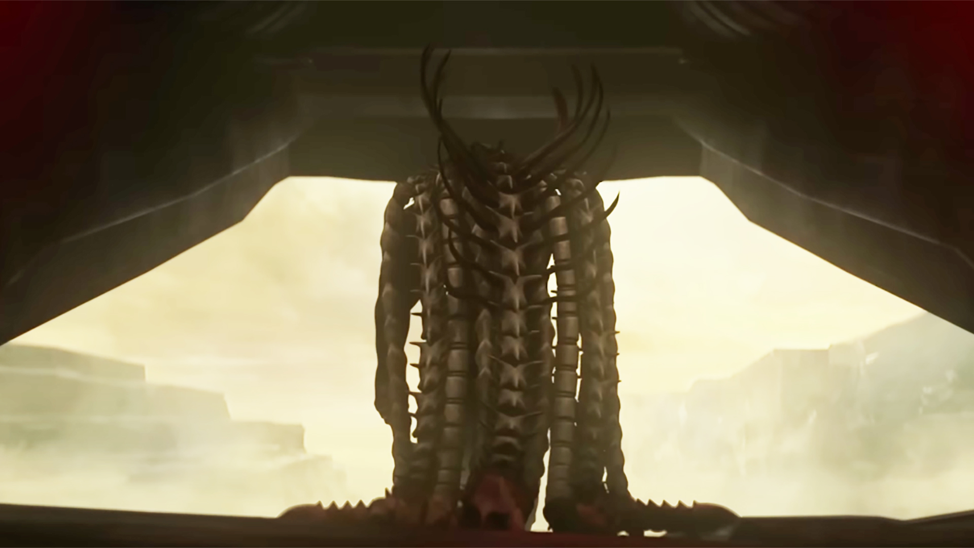 Predator: Killer of Killers still featuring a Yautja wearing a cape that appears to be made of Xenomorph tails