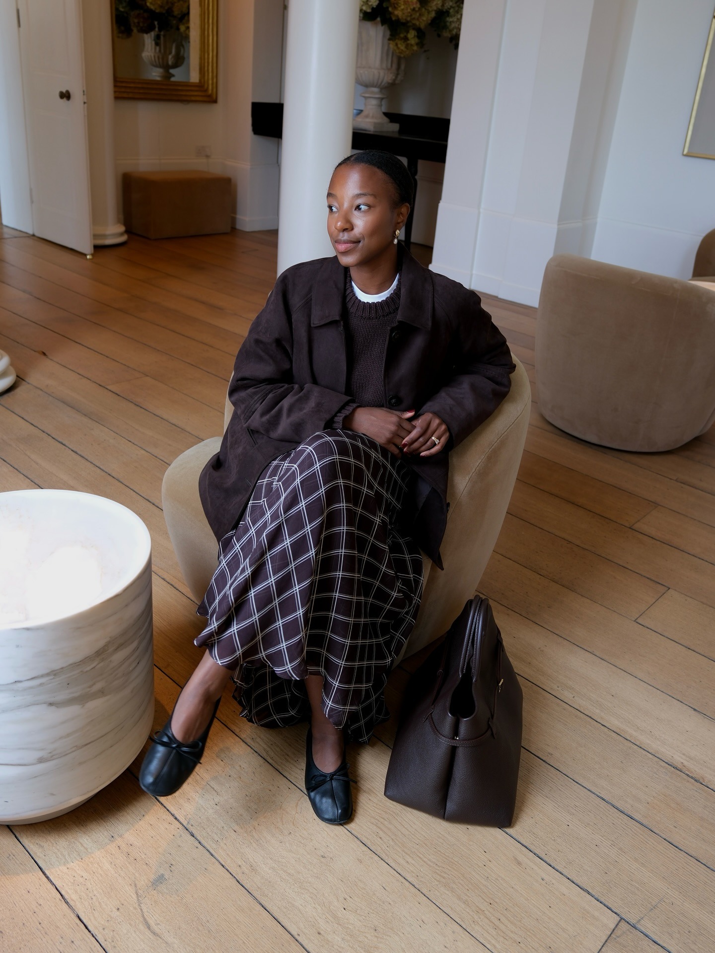 Photo of influencer wearing checkered plaid maxi skirt.