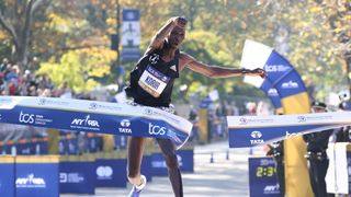 a photo of Albert Korir crossing the finish line of the NYC marathon 2021