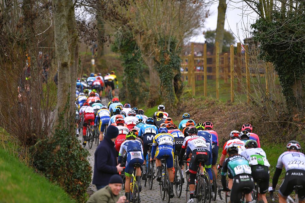 The peloton racing during Kuurne-Brussel-Kuurne