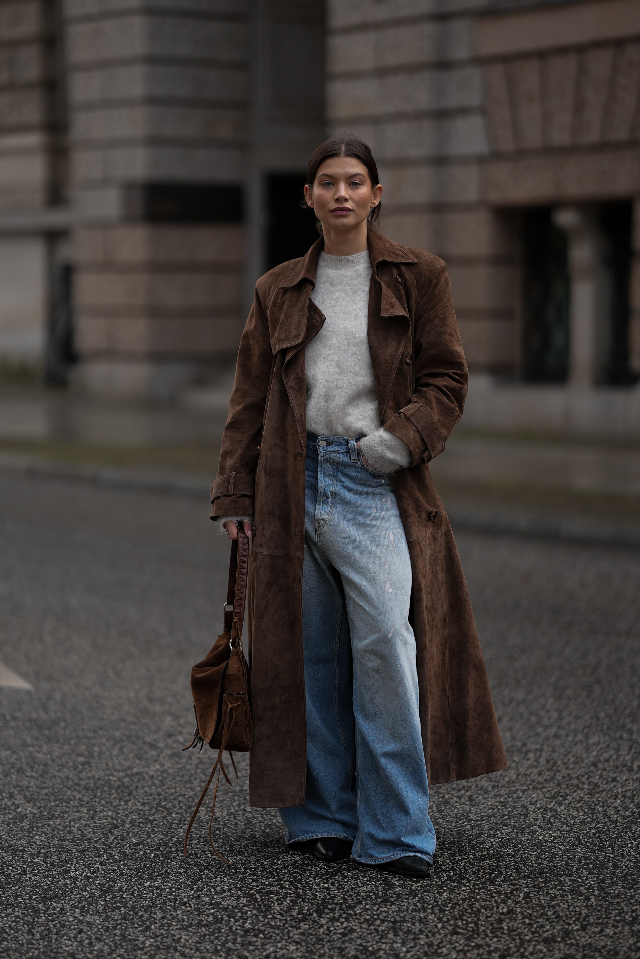 Woman wearing a light wash jeans outfit.