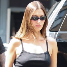 Hailey Bieber wore the flared leggings trend with slim sneakers