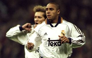 26 Feb 2000: Roberto Carlos of Real Madrid celebrates during the Spanish Primera Liga match against Barcelona played at the Bernabeau Stadium in Madrid, Spain. The match ended 3-0 to Real Madrid. \ Photos by Nuno Correia. \ Mandatory Credit: AllsportUK /Allsport