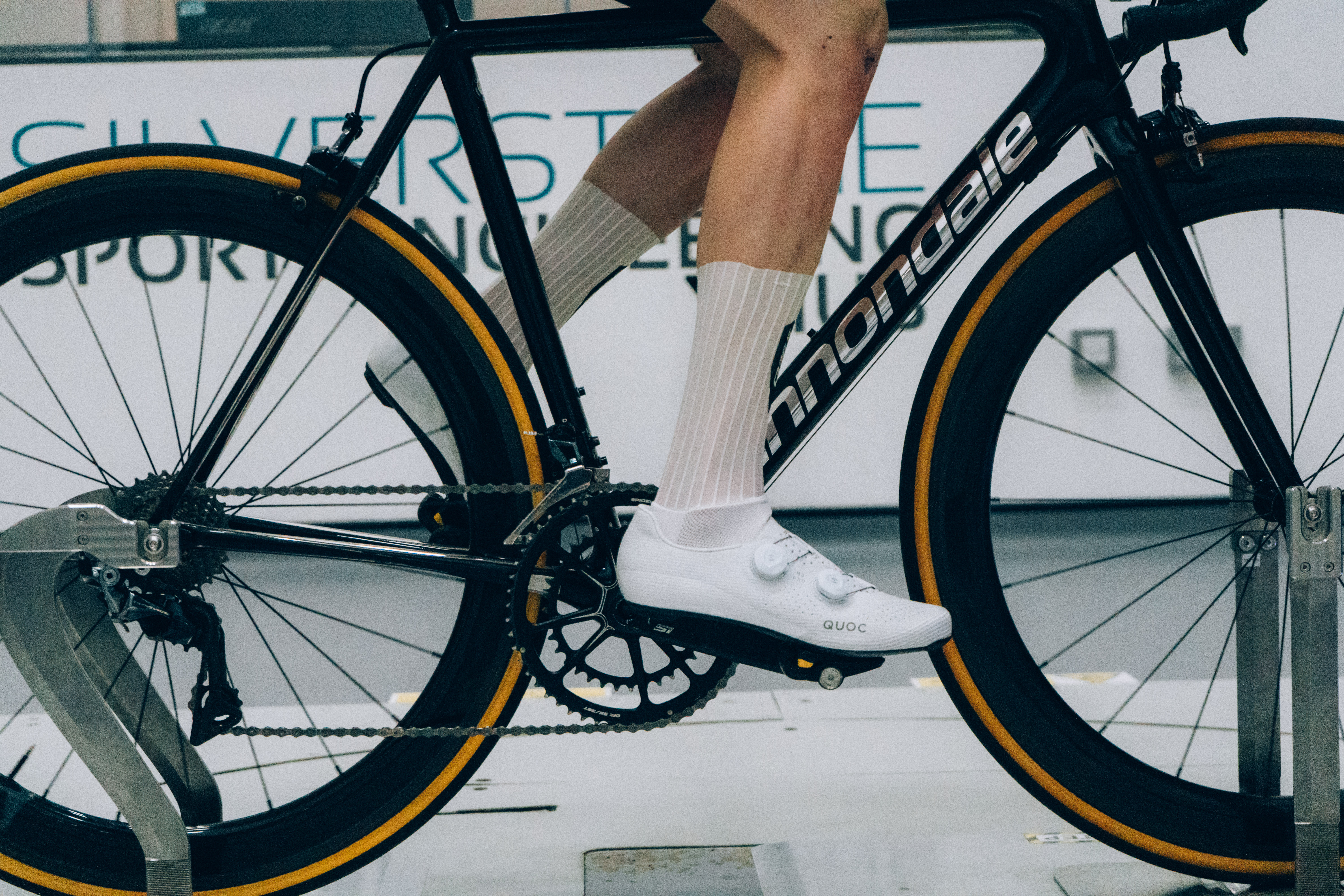 A close up of the socks that Tom is wearing while riding a bike in the wind tunnel