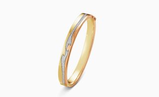 The Fusion bangle in yellow gold, rose gold and with centre white gold pavé