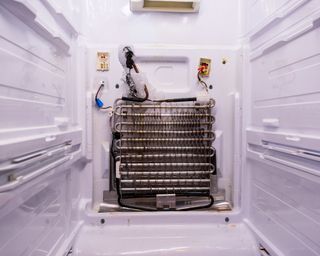 Fridge coils in a freezer compartment with the panel off