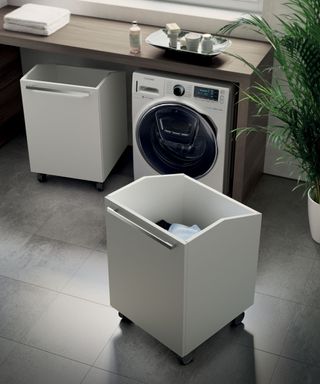 Wheeled bins for laundry by washing machine by Scavolini