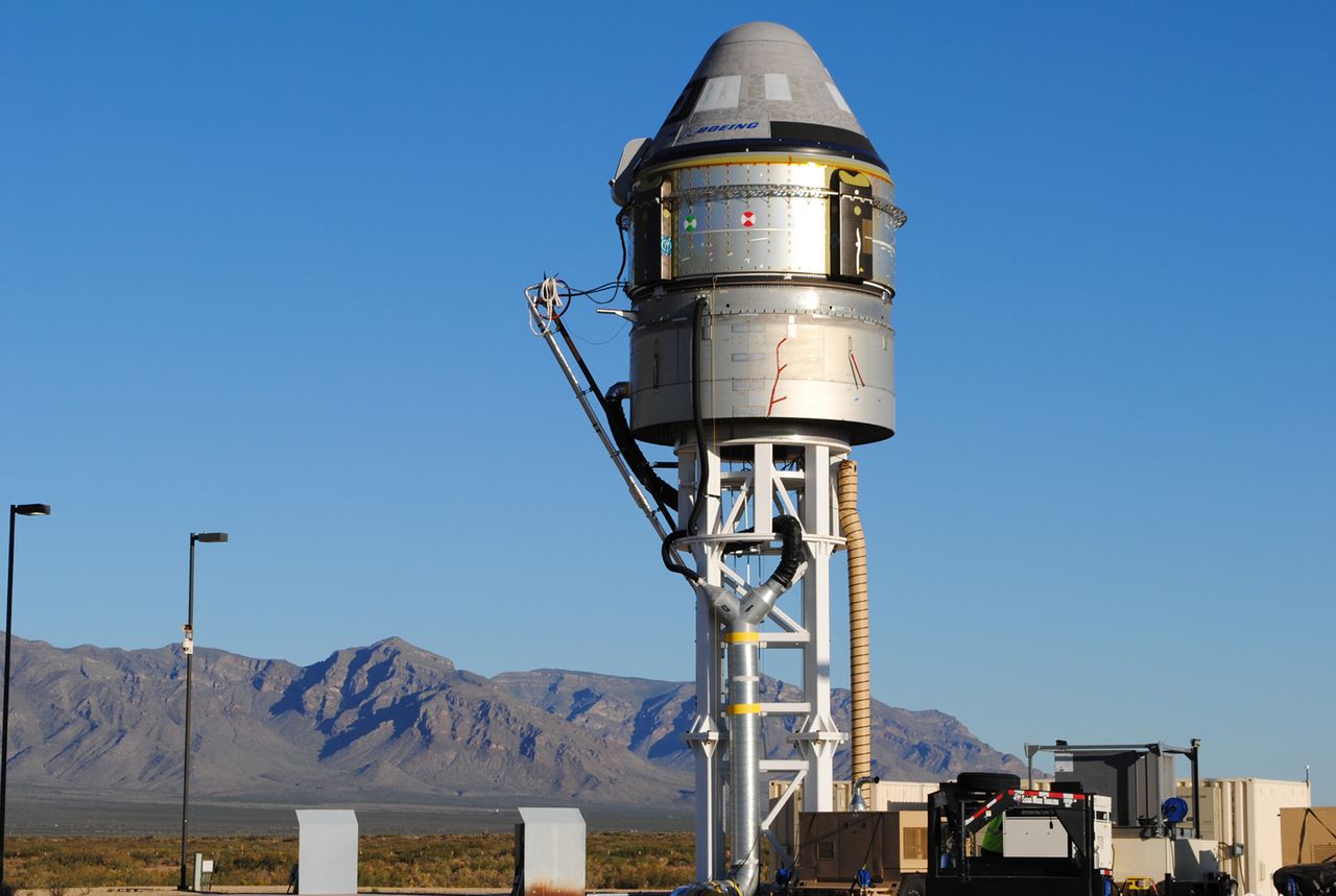 A Boeing CST-100 Starliner capsule is prepared for a critical launch abort system test at White Sands Missile Range in New Mexico. The Nov. 4, 2019 test will demonstrate a critical safety system for crewed launches.