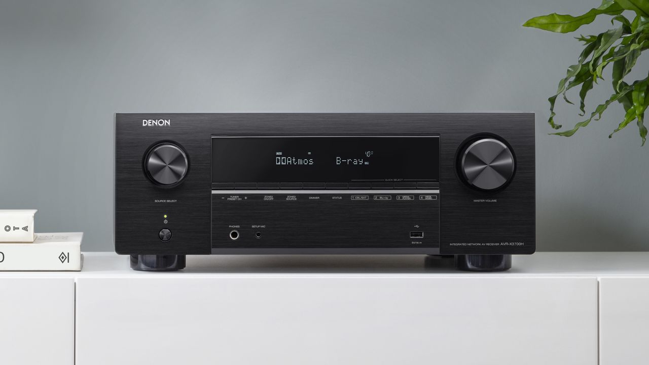 Denon AVC-X3700H review, showing the product sitting on a white shelf in a living room