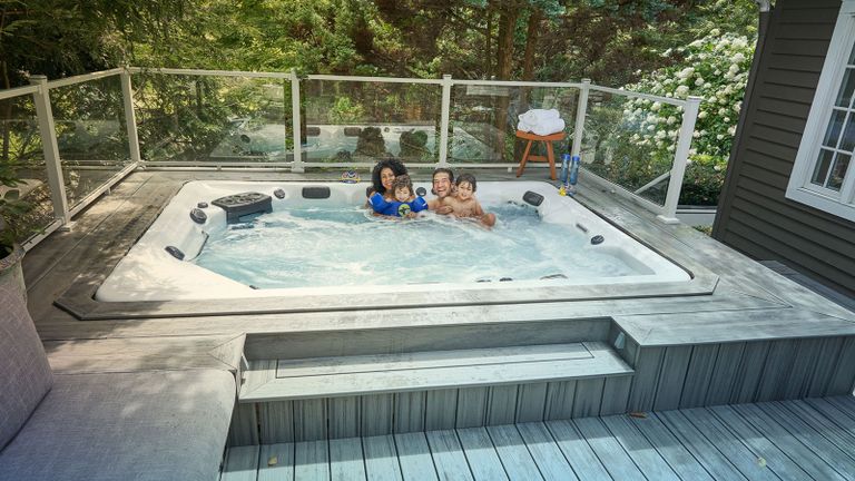 family in a hot tub on a deck
