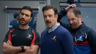 (L to R) Brett Goldstein (as Roy Kent), Jason Sudeikis (as Ted Lasso) and Brendan Hunt (as Coach Beard) in Ted Lasso season 3
