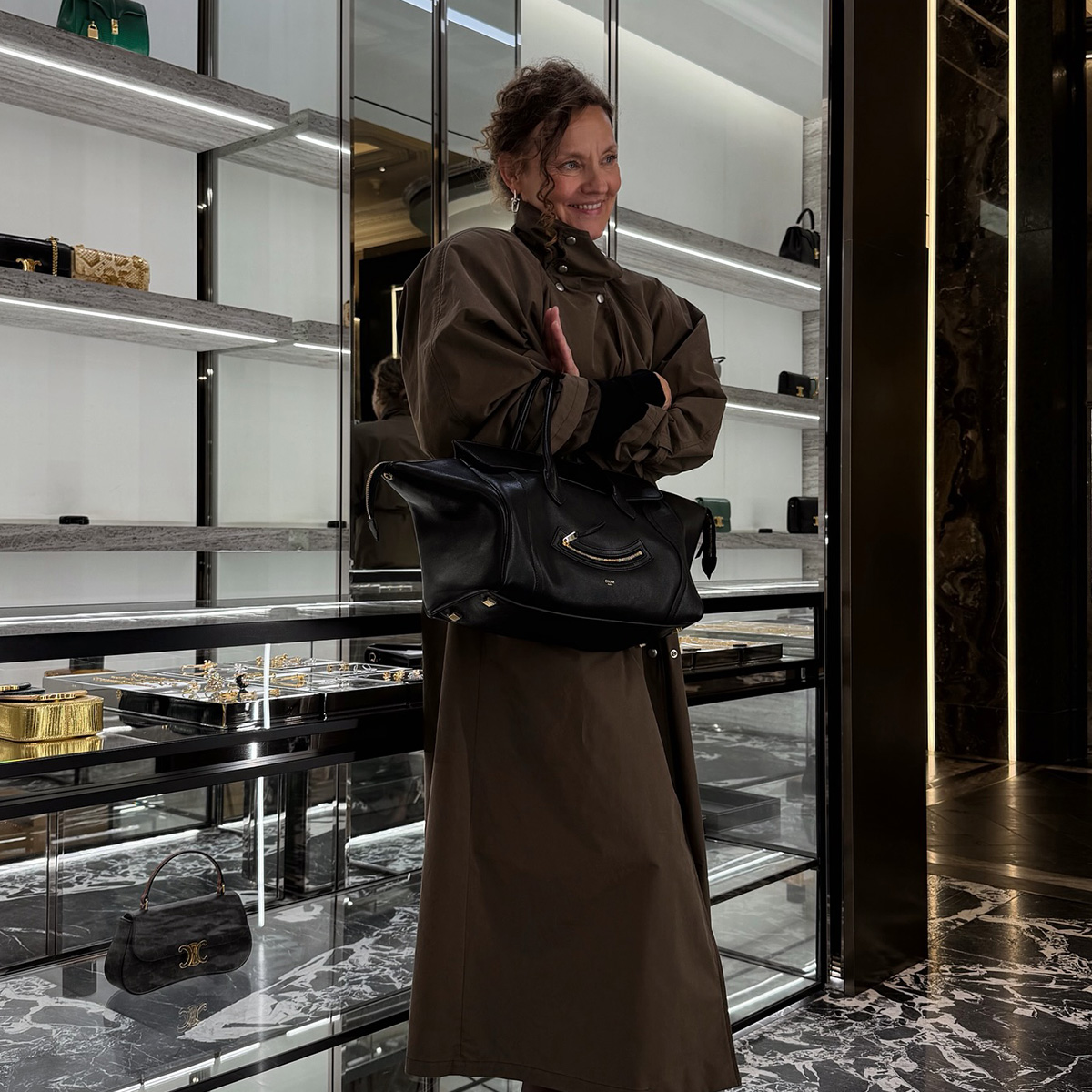 renia jaz at harrods trying on a celine bag