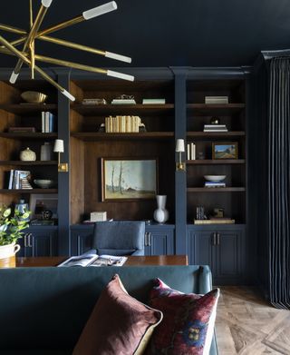 blue home office with a sofa by Marie Flanigan