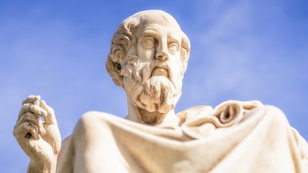 A front view close up of the marble statue of the ancient Greek philosopher Plato, located outside the Academy of Athens. The statue was completed in 1885 by Leonidas Drosis.