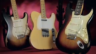 Two Fender Stratocasters and a Telecaster with a cactus in the background