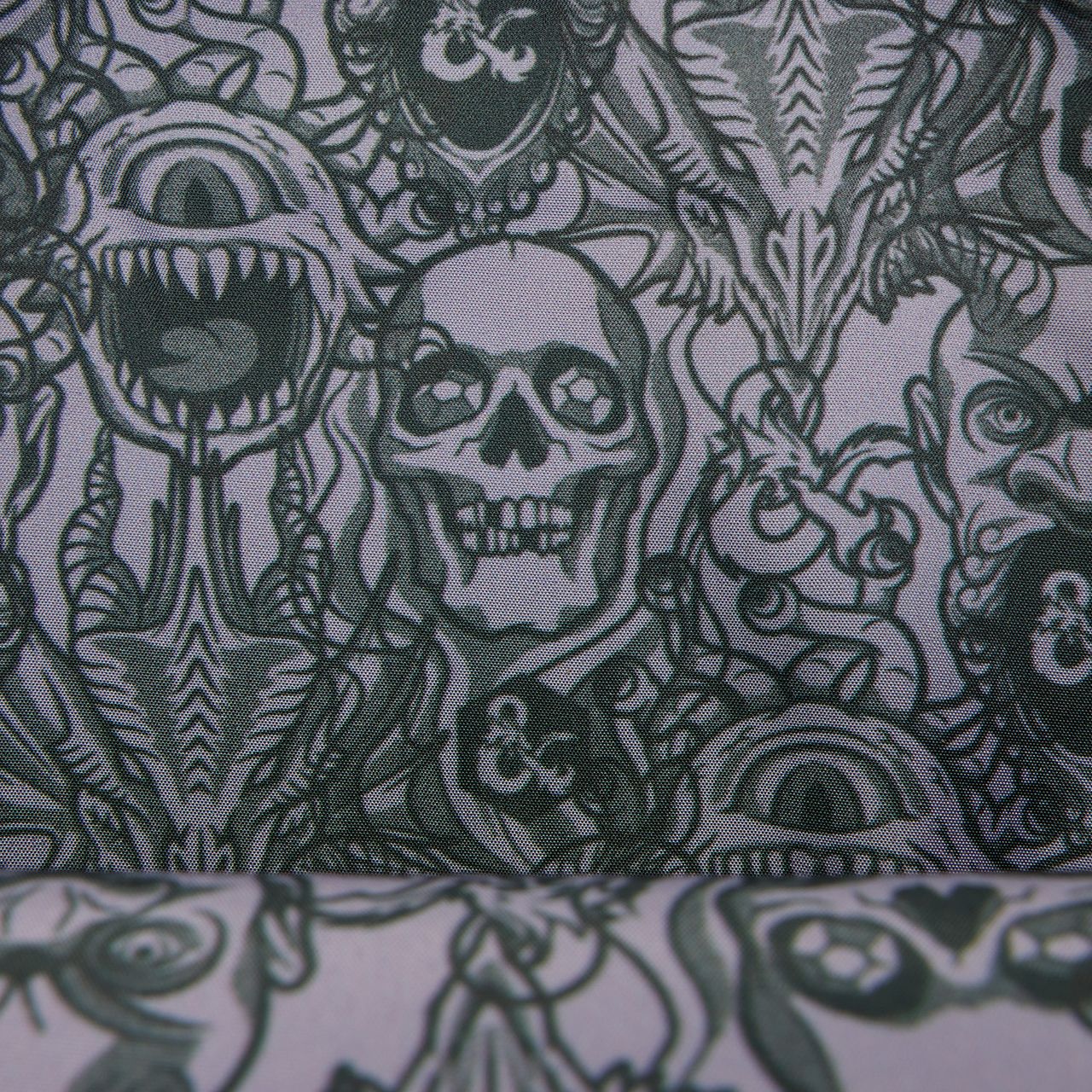 D&amp;D Loungefly Crossbody Bag interior design, featuring the faces of numerous monsters