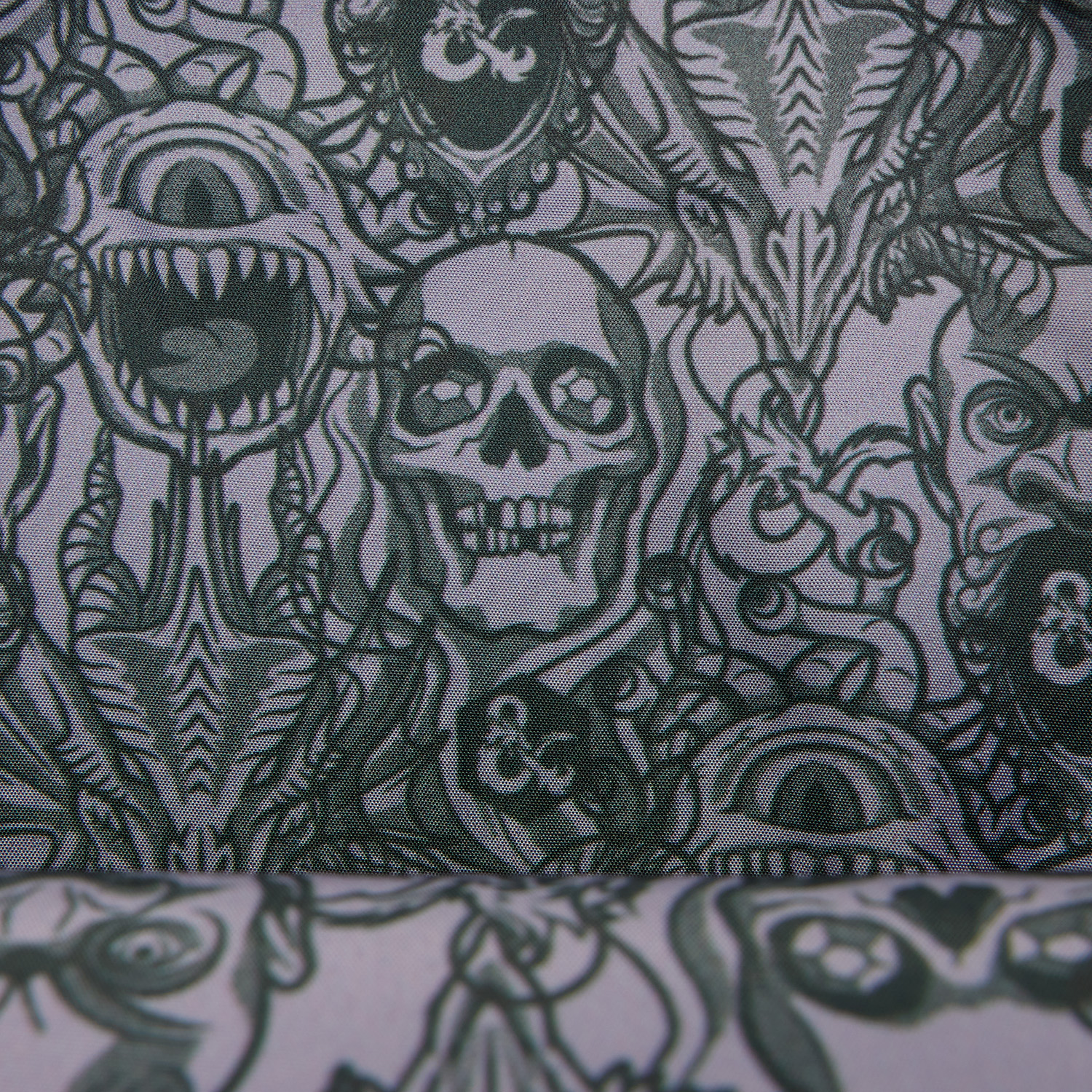D&D Loungefly Crossbody Bag interior design, featuring the faces of numerous monsters