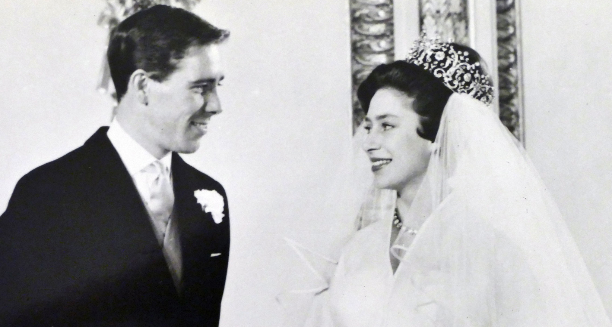 Antony Armstrong Jones and Princess Margaret smiling at each other on their wedding day
