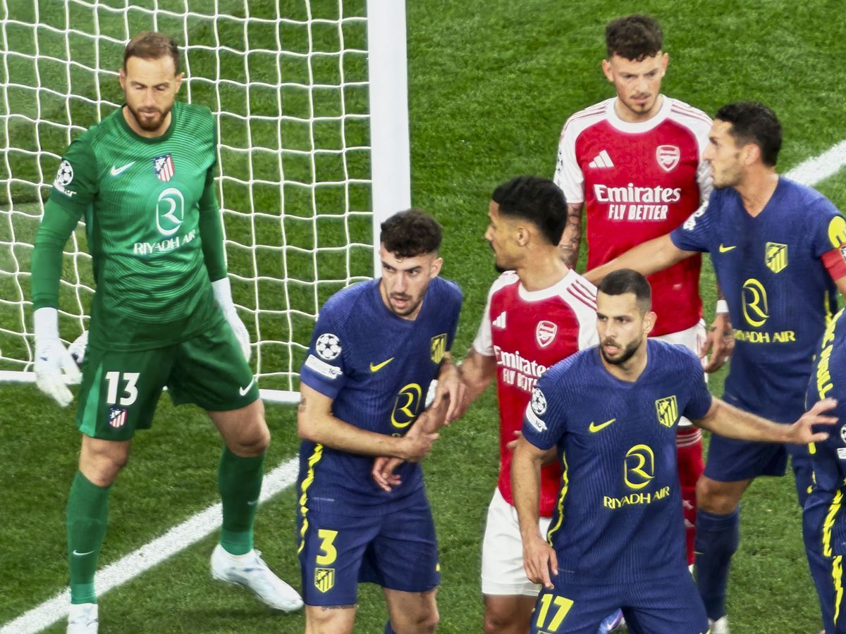 A Champions League soccer match between Arsenal and Atletico Madrid, as seen from the upper stand at the Emirates stadium, London. Zoomed in photos of the players