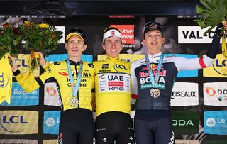 PLATEAU DU MONT-CENIS, FRANCE - JUNE 15: (L-R) Jonas Vingegaard of Denmark and Team Visma | Lease a Bike on second place, race winner Tadej Pogacar of Slovenia and UAE Team Emirates - XRG - Yellow leader jersey and Florian Lipowitz of Germany and Team Red Bull - BORA - hansgrohe on third place pose on the podium ceremony after the 77th Criterium du Dauphine 2025, Stage 8 a 133.3km stage from Val-d'Arc to Plateau du Mont-Cenis 2095m / #UCIWT / on June 15, 2025 in Plateau du Mont-Cenis, France. (Photo by Dario Belingheri/Getty Images)