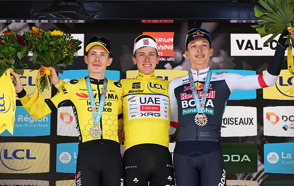 PLATEAU DU MONT-CENIS, FRANCE - JUNE 15: (L-R) Jonas Vingegaard of Denmark and Team Visma | Lease a Bike on second place, race winner Tadej Pogacar of Slovenia and UAE Team Emirates - XRG - Yellow leader jersey and Florian Lipowitz of Germany and Team Red Bull - BORA - hansgrohe on third place pose on the podium ceremony after the 77th Criterium du Dauphine 2025, Stage 8 a 133.3km stage from Val-d&amp;apos;Arc to Plateau du Mont-Cenis 2095m / #UCIWT / on June 15, 2025 in Plateau du Mont-Cenis, France. (Photo by Dario Belingheri/Getty Images)