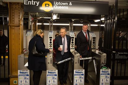 New York City Mayor Bill de Blasio rides the subway
