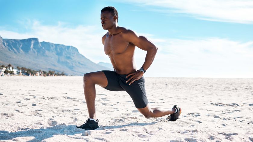 a photo of a man doing a low lunge