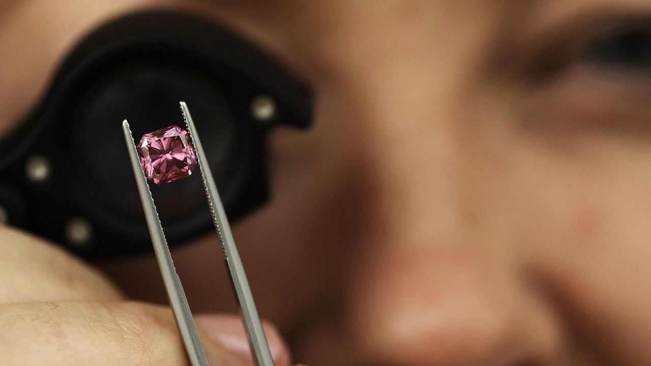 Jeweller inspecting a diamond