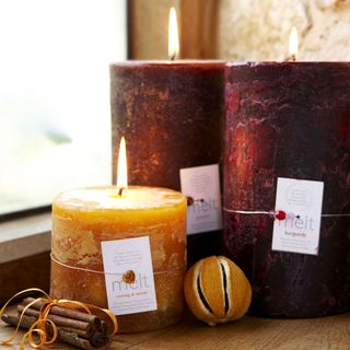 burgundy and orange scented candles