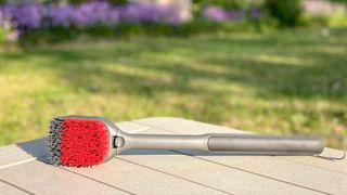 OXO Good Grips Grilling Cold Clean Grill Brush on a table