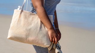 woman with beach bag