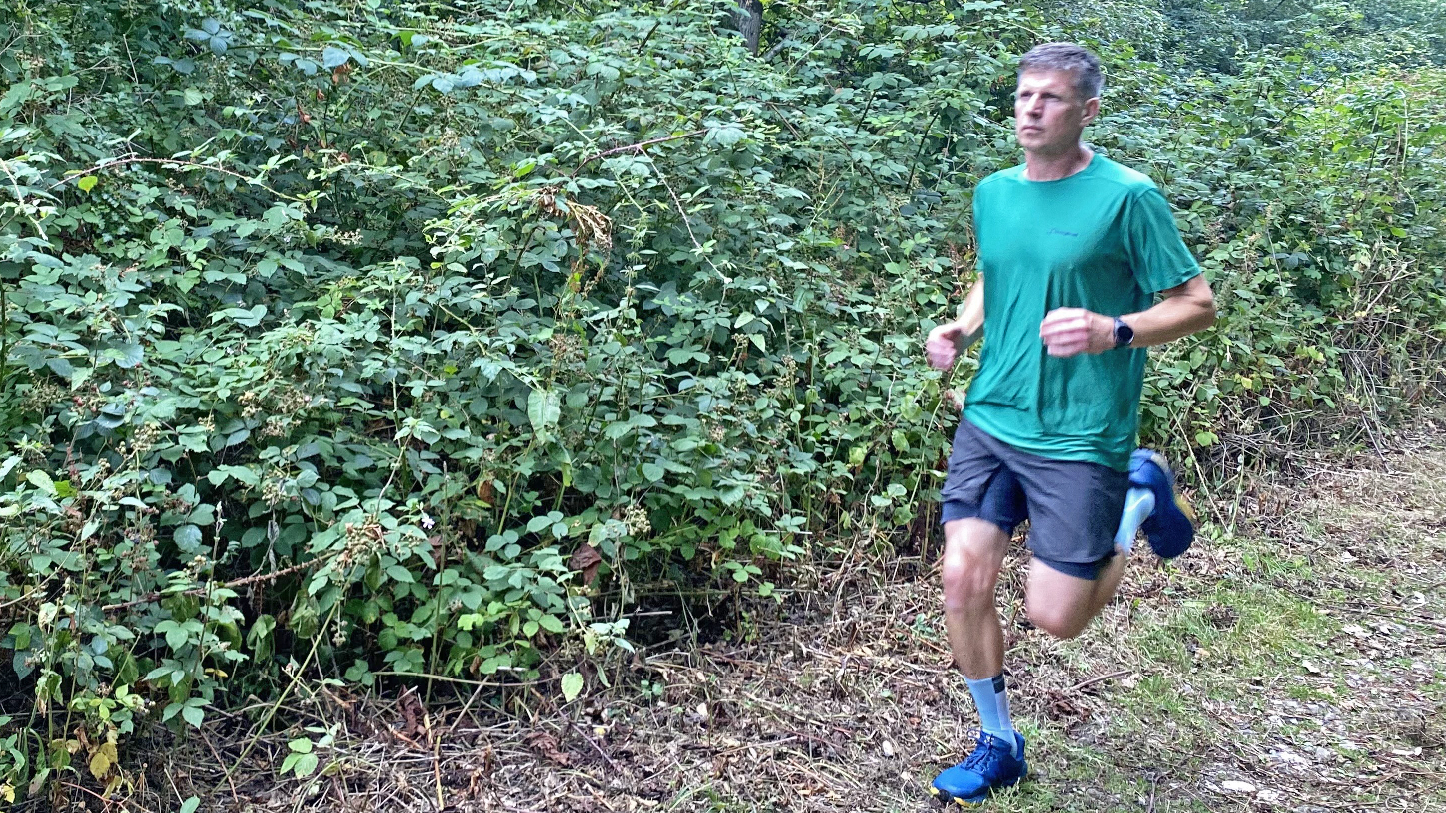 Runner on the trails wearing the Buff CoolNet Crew Running Socks