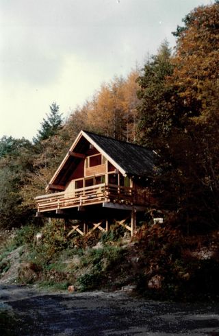 images from cabin crew, a new book on welsh modernist cabins showing small, low timber structures in the woods