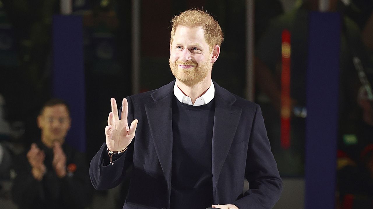 Prince Harry walks to centre ice before a ceremonial face-off during the NHL game between the Vancouver Canucks the San Jose Sharks at Rogers Arena on November 20, 2023 in Vancouver, British Columbia.