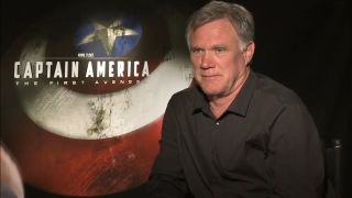 Joe Johnston sits down during an interview for Captain America: The First Avenger.