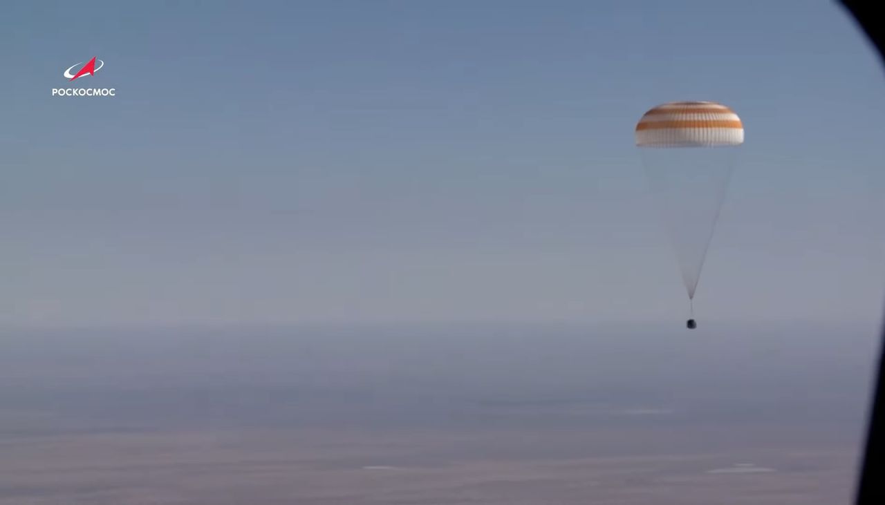 A Soyuz MS-18 space capsule carrying Russian actress Yulia Peresild, director Klim Shipenko and cosmonaut Oleg Novitskiy returns to Earth under a parachute during a successful landing in Kazakhstan on Oct. 17, 2021.