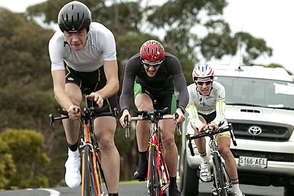 Some traffic as riders begin to tire approaching the finish in Portarlington.