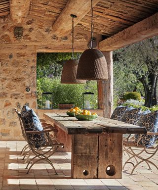 Outdoors dining area on terrace in french cottage